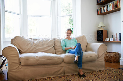 Buy stock photo Portrait of a young woman relaxing at home
