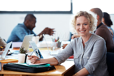 Buy stock photo Cropped shot of a group of colleagues working in the office