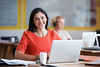 Buy stock photo Cropped portrait of an attractive businesswomen working on a laptop
