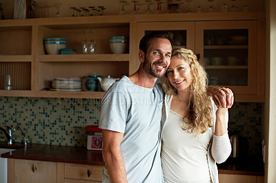 Buy stock photo Cropped shot of an affectionate couple in the kitchen