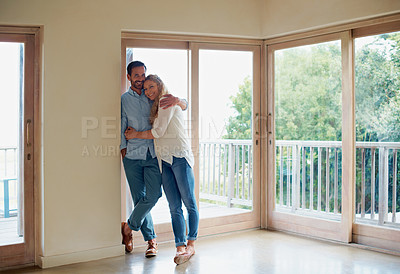 Buy stock photo Portrait of an affectionate couple standing in their home