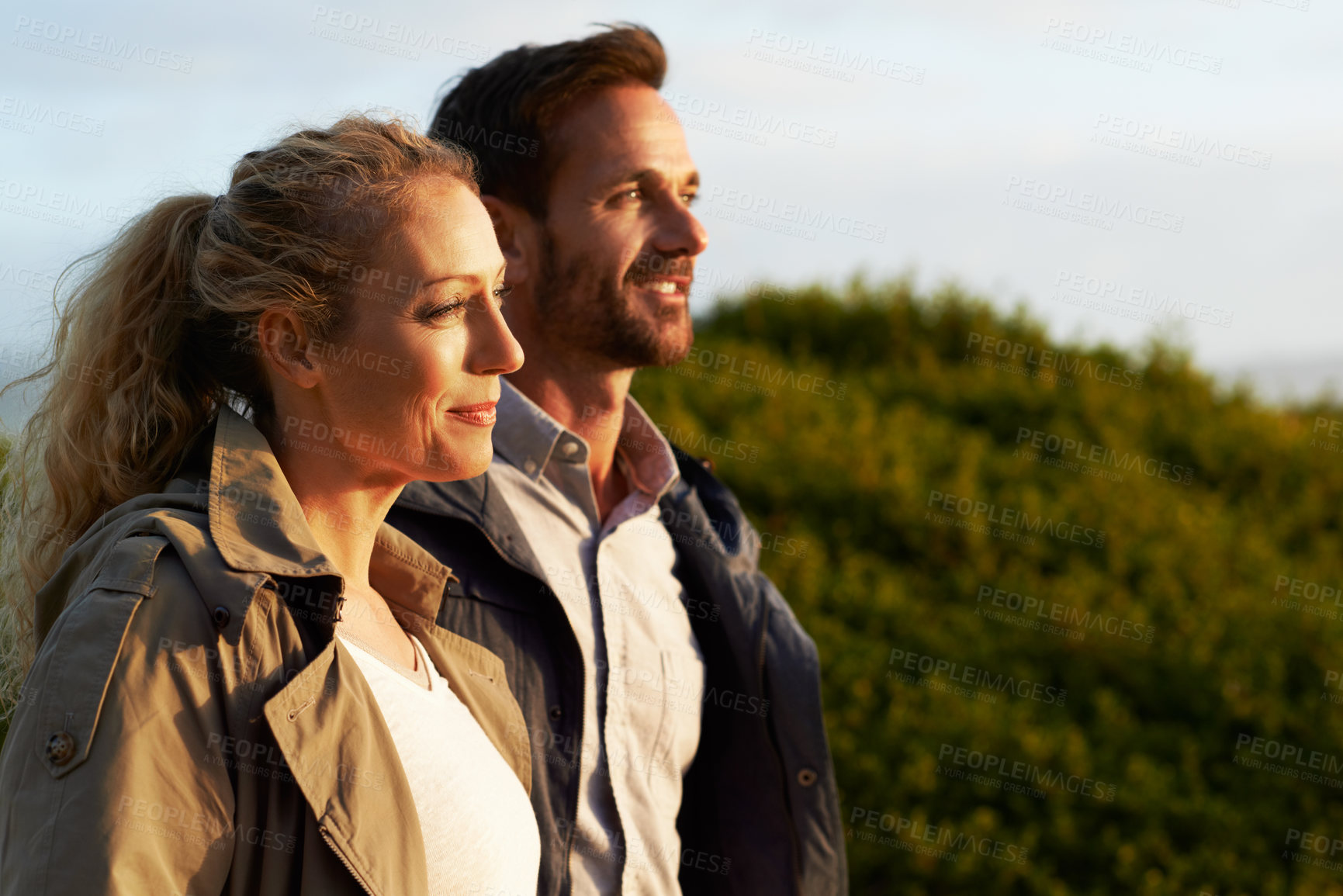 Buy stock photo Cropped shot of an affectionate couple standing outdoors