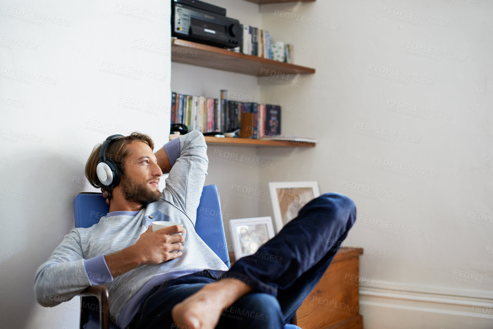 Buy stock photo Relax, coffee and happy man with headphones for music, audio streaming or holiday in home. Male person, chilling and smile with drink or sound app for weekend entertainment or song playlist in house