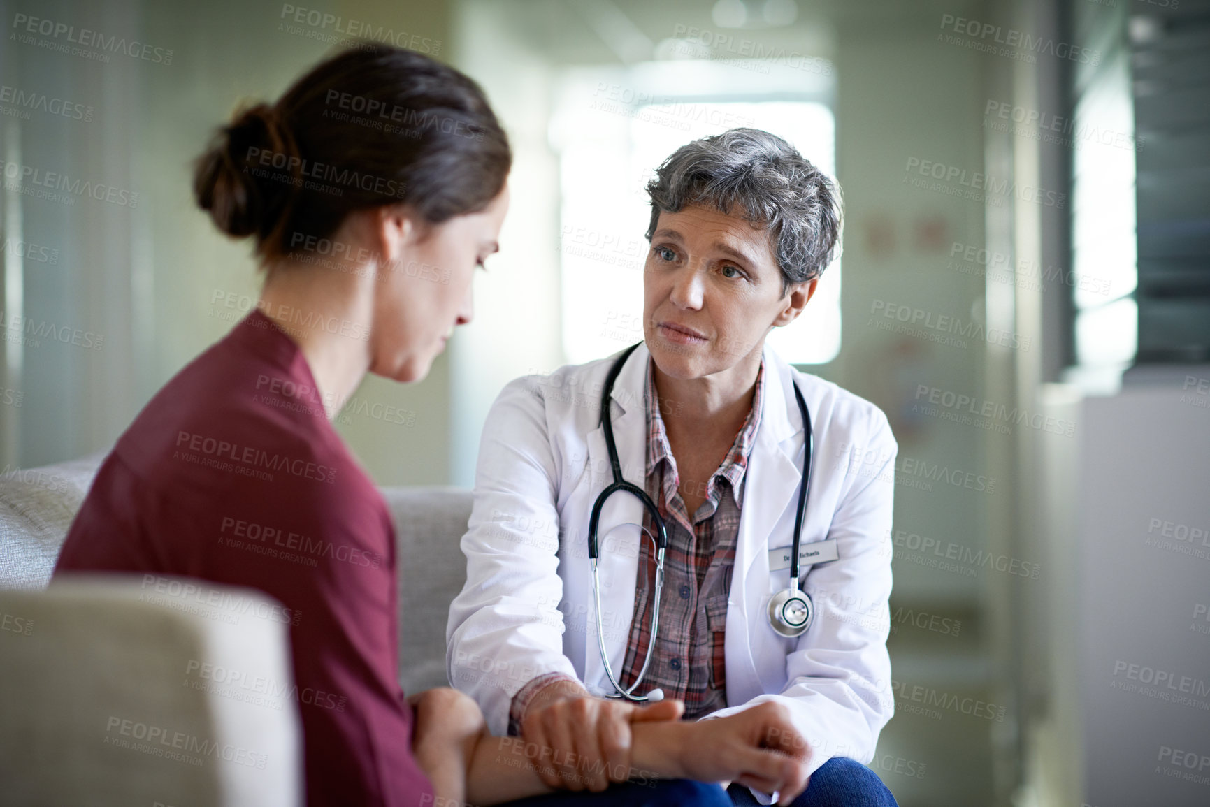 Buy stock photo Medical, doctor or console woman in waiting room for bad news, critical health update or empathy. Hospital, mature worker and emotional support for surgery complication, patient loss and compassion