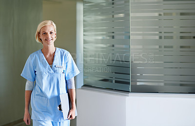 Buy stock photo Portrait of a beautiful young doctor standing in a hospital