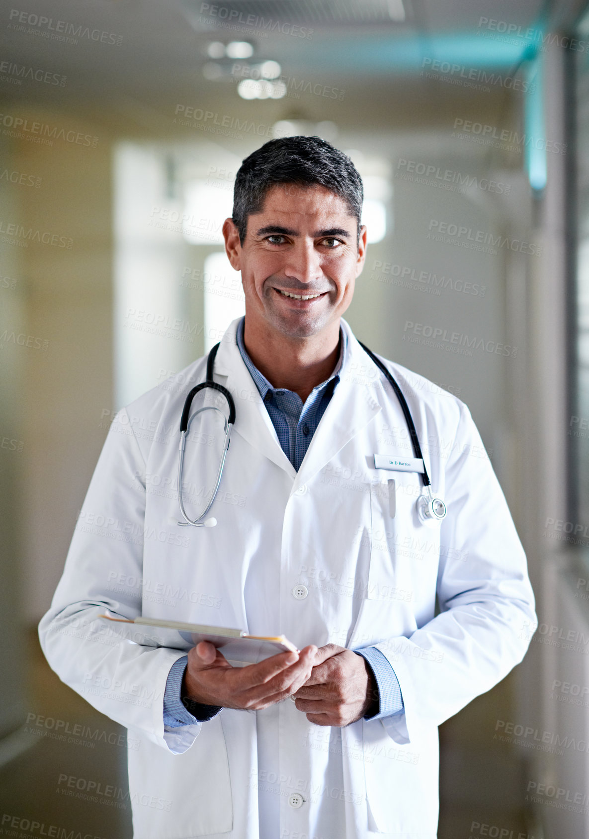 Buy stock photo Checklist, doctor and happy man in hospital for healthcare service, career integrity and experience. Mature person, medical worker or physician with clipboard, portrait and smile in hallway in Canada