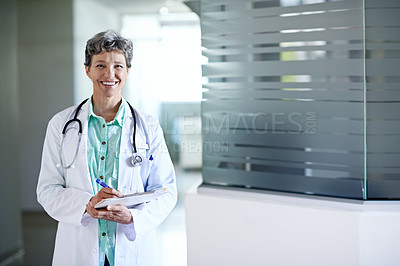 Buy stock photo Portrait of a confident mature doctor standing in a hospital
