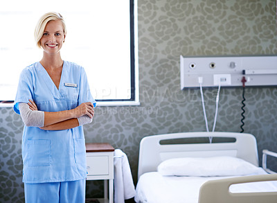 Buy stock photo Portrait of a beautiful young doctor standing in a hospital