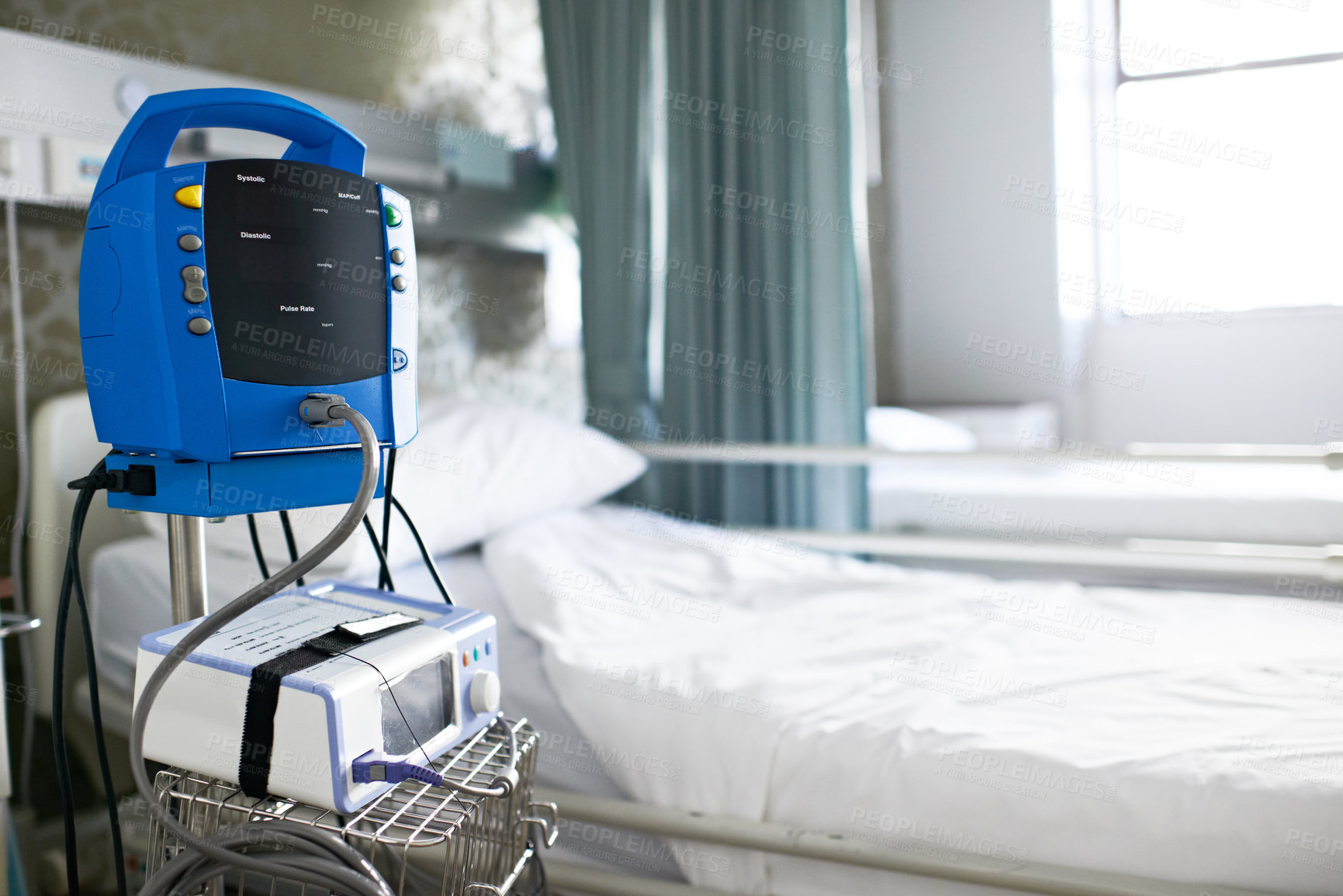 Buy stock photo Hospital bed, machine and room for healthcare, icu and EKG screen for rehabilitation in ward. Clinic interior, medical equipment and monitor with ECG, iv drip and healing with wellness in facility