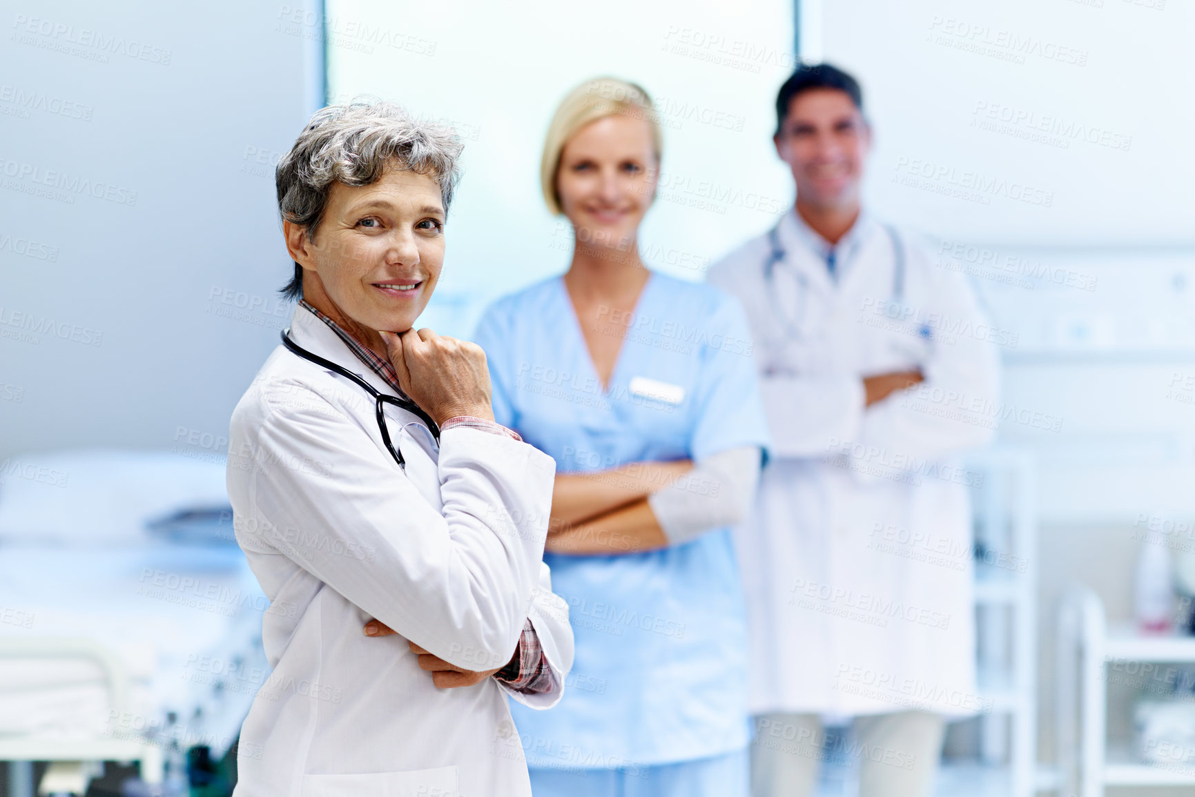 Buy stock photo Doctor, staff and happy in portrait for healthcare service, patient care and clinic management. Workers, mature woman or team with confidence in ward for health support, expertise or shift leadership