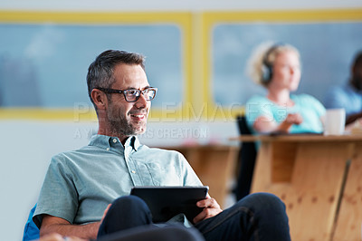 Buy stock photo Cropped shot of a businessman using a digital tablet in the office