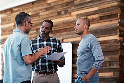 Buy stock photo Cropped shot of three businessmen in an office
