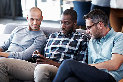 Buy stock photo Cropped shot of three businessmen in an office