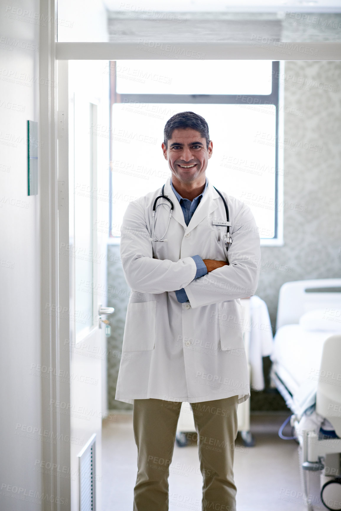 Buy stock photo Arms crossed, healthcare and portrait of doctor in hospital for medical advice, about us and gp consultant. Confidence, expert and pride with person in clinic for cardiology specialist and physician