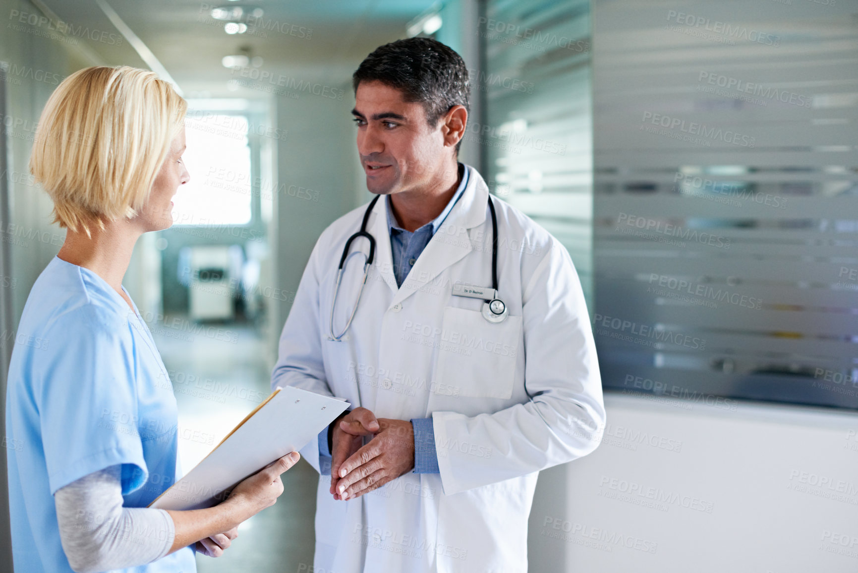Buy stock photo Doctor, nurse and meeting in hospital at clipboard, medical report and patient chart for diagnosis. People, healthcare and team in workplace with checklist, pathology results and surgery guidelines