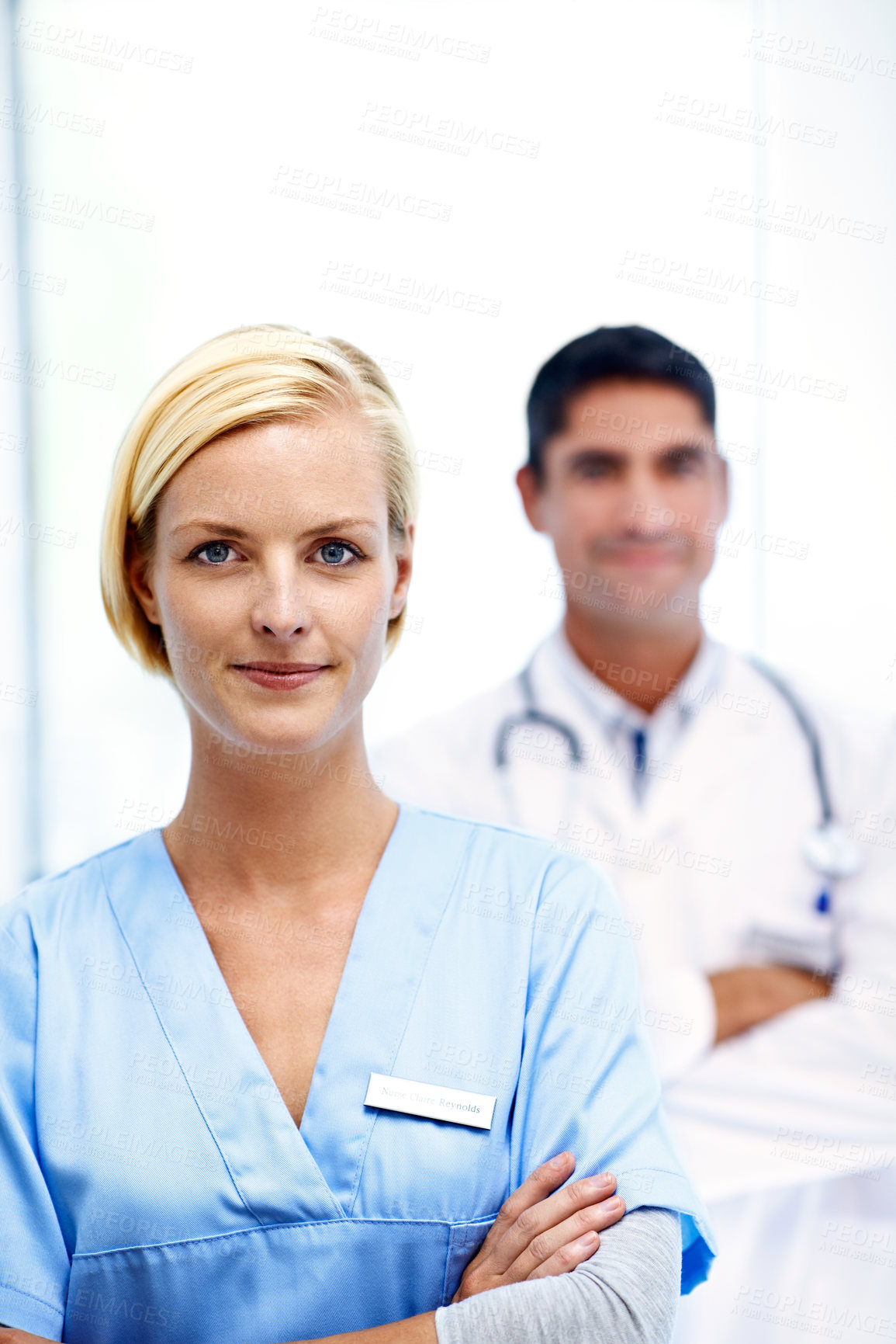 Buy stock photo Portrait of a female doctor with a colleague in the background