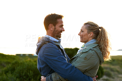 Buy stock photo Cropped shot of an affectionate couple standing outdoors