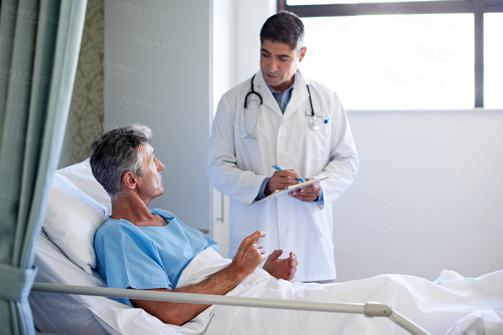 Buy stock photo Hospital, clipboard and doctor with patient in bed for consulting, surgery results and feedback. Healthcare, talking and people for conversation with health report, wellness and medical service