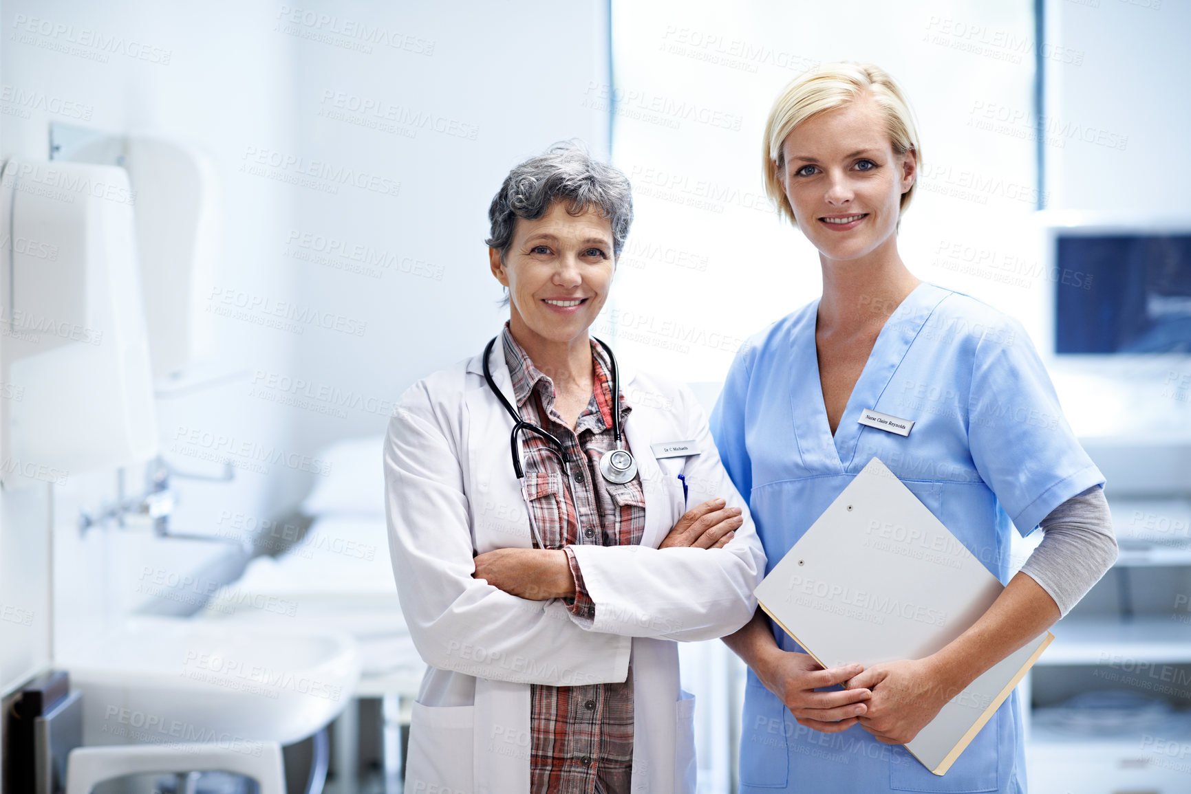 Buy stock photo Portrait, doctor and nurse in hospital with clipboard for medical service, collaboration and about us. Happy, healthcare team and women with crossed arms, pride and wellness for health support