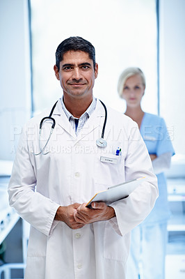 Buy stock photo Portrait of two medical professionals standing in a hospital ward