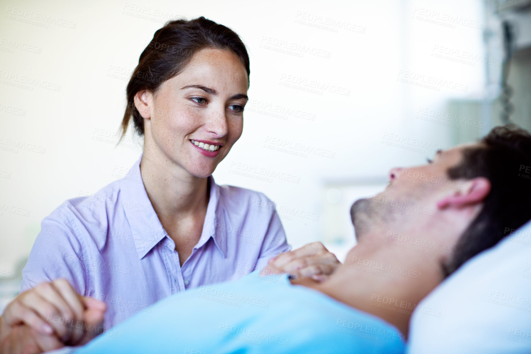 Buy stock photo Holding hands, smile and woman with man in hospital bed for healthcare, surgery recovery or visit. Care, love and support with happy couple in medical clinic together for help, rehabilitation or rest