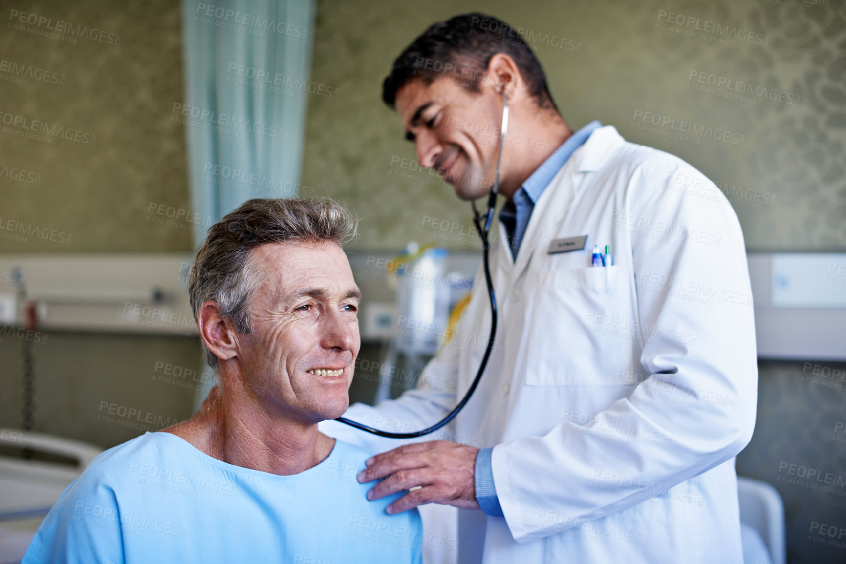 Buy stock photo Doctor, man or happy patient with stethoscope for exam, healthcare diagnosis or test in hospital bed. Male person, health worker or cardiologist listening for medical examination or checkup in ICU