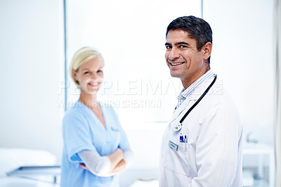 Buy stock photo Portrait of two medical professionals standing in a hospital ward