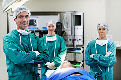 Buy stock photo Portrait of surgeons working on a patient in an operating room
