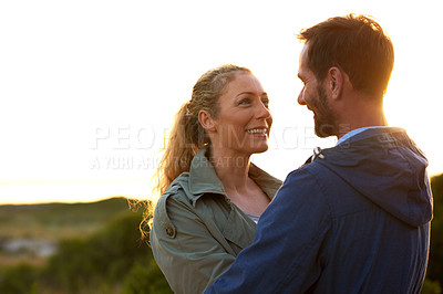 Buy stock photo Shot of an adventurous couple spending time in the outdoors