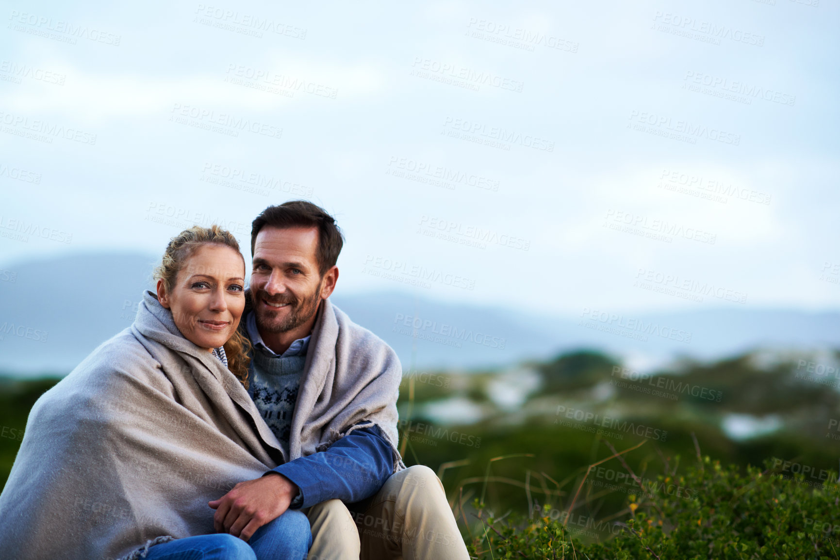 Buy stock photo Travel, happy couple and blanket in nature to relax, weekend getaway and comfort on romantic date. Space, portrait or mature people with love outdoor for cozy holiday, marriage outing or cold weather
