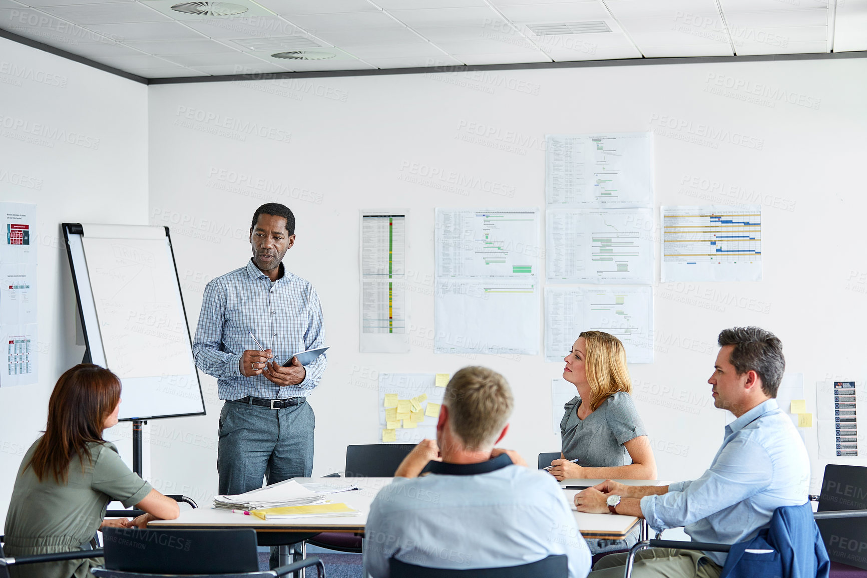 Buy stock photo Business people, man and presentation in meeting with tablet, review and discussion at financial office. Group, pitch or strategy with graphs, collaboration and account insight at investment agency