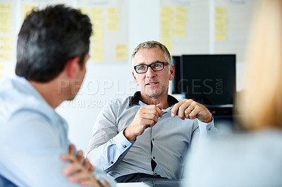 Buy stock photo Shot of a group of coworkers having a meeting in an office