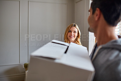 Buy stock photo Cropped shot of a young couple moving in to their new house
