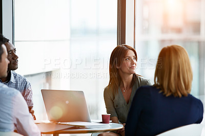 Buy stock photo Shot of a group of coworkers having a meeting in an office