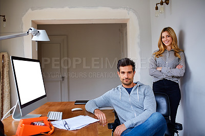 Buy stock photo Portrait of a young couple working together in their home office
