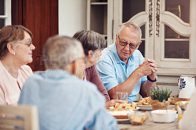 Buy stock photo Cropped shot of a group of senior citizens sitting together and enjoying a tea party outdoors