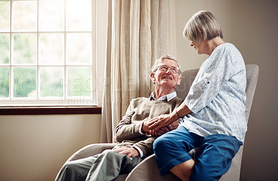 Buy stock photo Shot of a senior couple sharing an affectionate moment at home