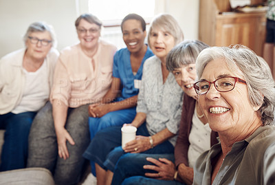 Buy stock photo Cropped portrait of a happy senior woman taking a selfie with her friends and nurse in the living room