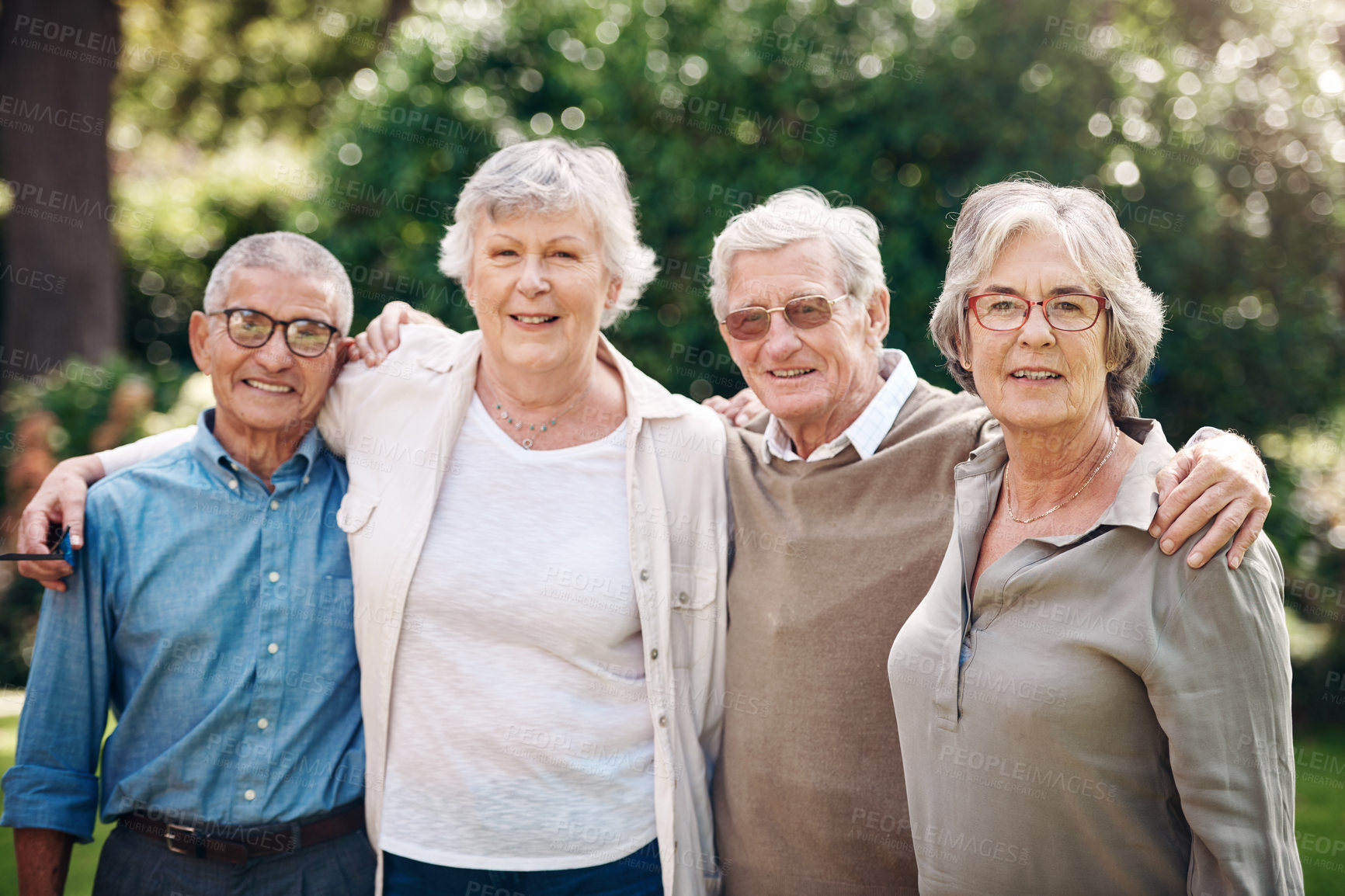 Buy stock photo Hug, friends and senior people in garden for bonding, fresh air and wellness for retirement. Happy, portrait and elderly men and women with embrace for connection, support and community outdoor