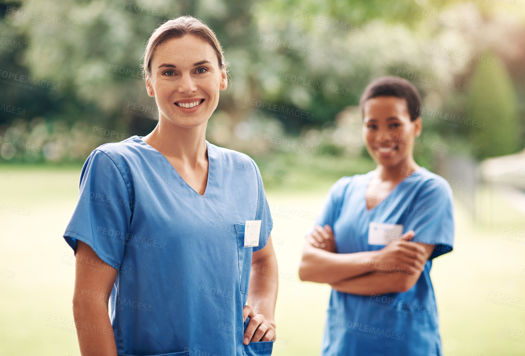 Buy stock photo Woman, nurse team and outdoor at retirement home for medical service, help and nursing career. Portrait, happy and caregiver for senior care, assisted living and crossed arms at healthcare facility