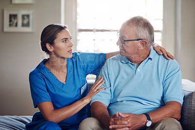 Buy stock photo Shot of a senior man being cared for by a young nurse at home