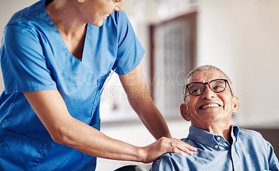 Buy stock photo Shot of a senior man in a wheelchair being cared for by a nurse at home