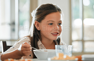 Buy stock photo Cropped shot of an adorable little girl having breakfast at home
