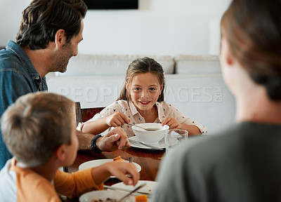 Buy stock photo Shot of a family of four having breakfast together at home