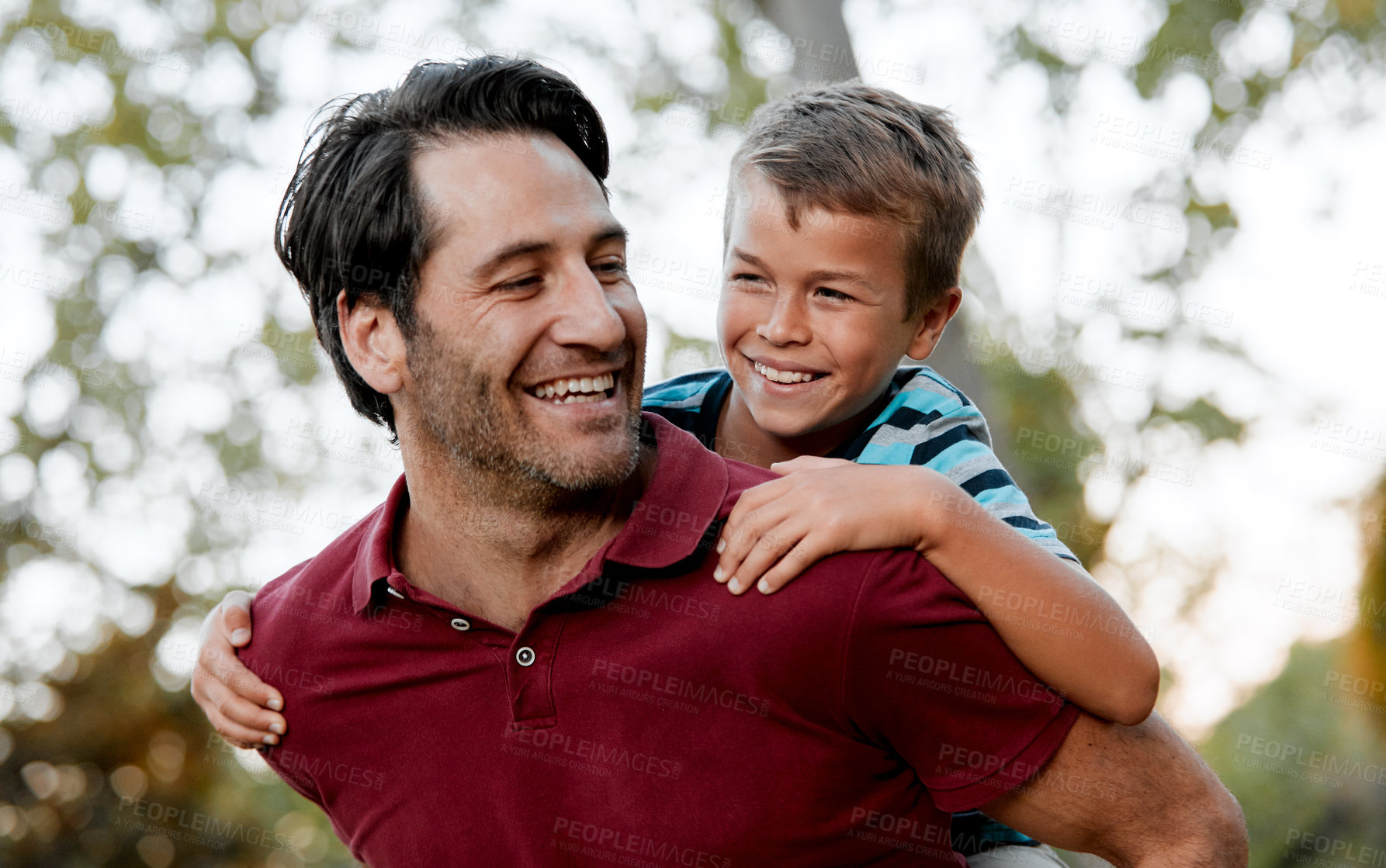 Buy stock photo Piggyback, happiness and man with kid in park, game or fun together with travel and quality time. Smile, playful and father with son in nature, family vacation and bonding with care, trust and trip