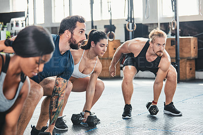 Buy stock photo Cropped shot of a group of young athletes in an exercise class at the gym