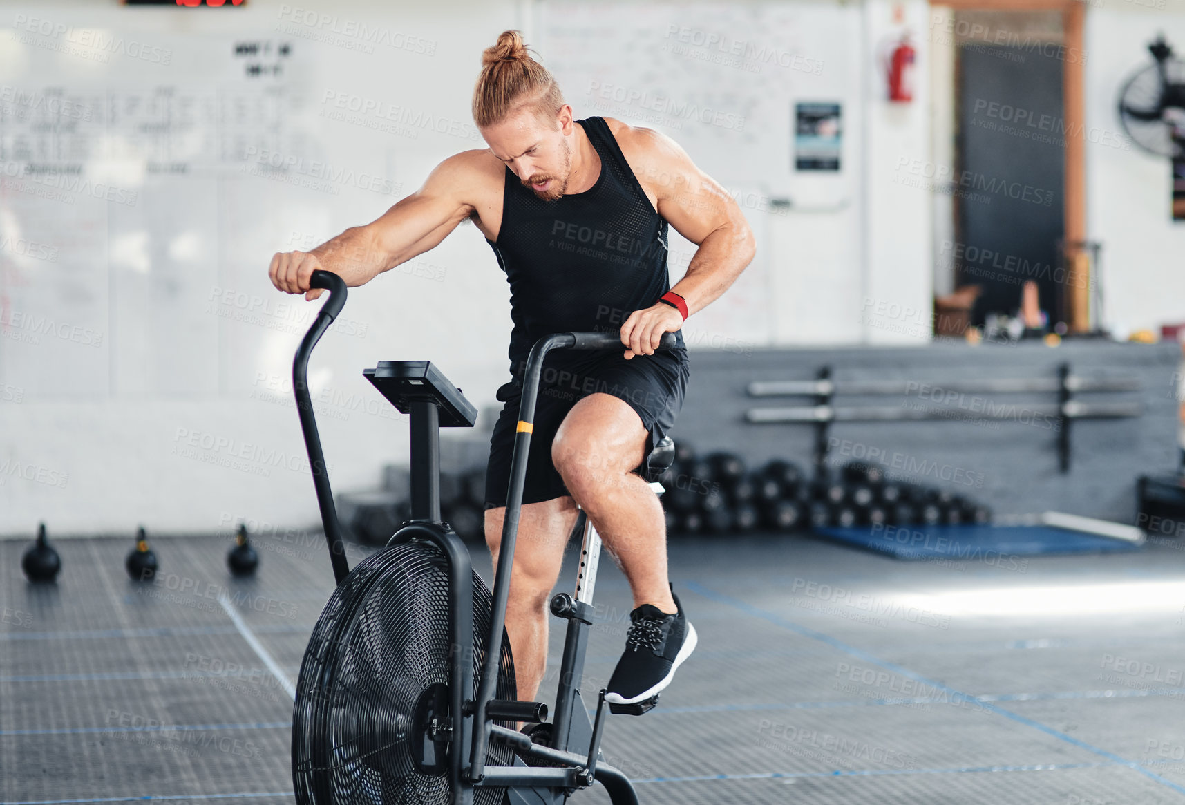 Buy stock photo Shot of a man doing cardio at the gym