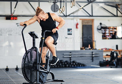 Buy stock photo Shot of a man doing cardio at the gym