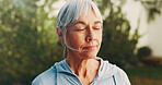 Eyes closed, fitness and senior woman outdoor for reflection, mindfulness and breathe for wellness. Backyard, morning and person with calm, thoughtful and fresh air for break, active and wellbeing