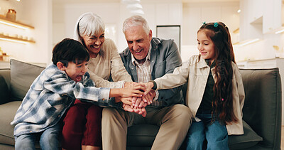 Buy stock photo Playing, grandparents and children with hands stack for bonding, love and connection for visit. Family, sofa and kids with senior people for relationship, games and relax together on weekend in home